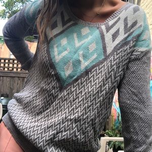 grey and blue patterned sweater